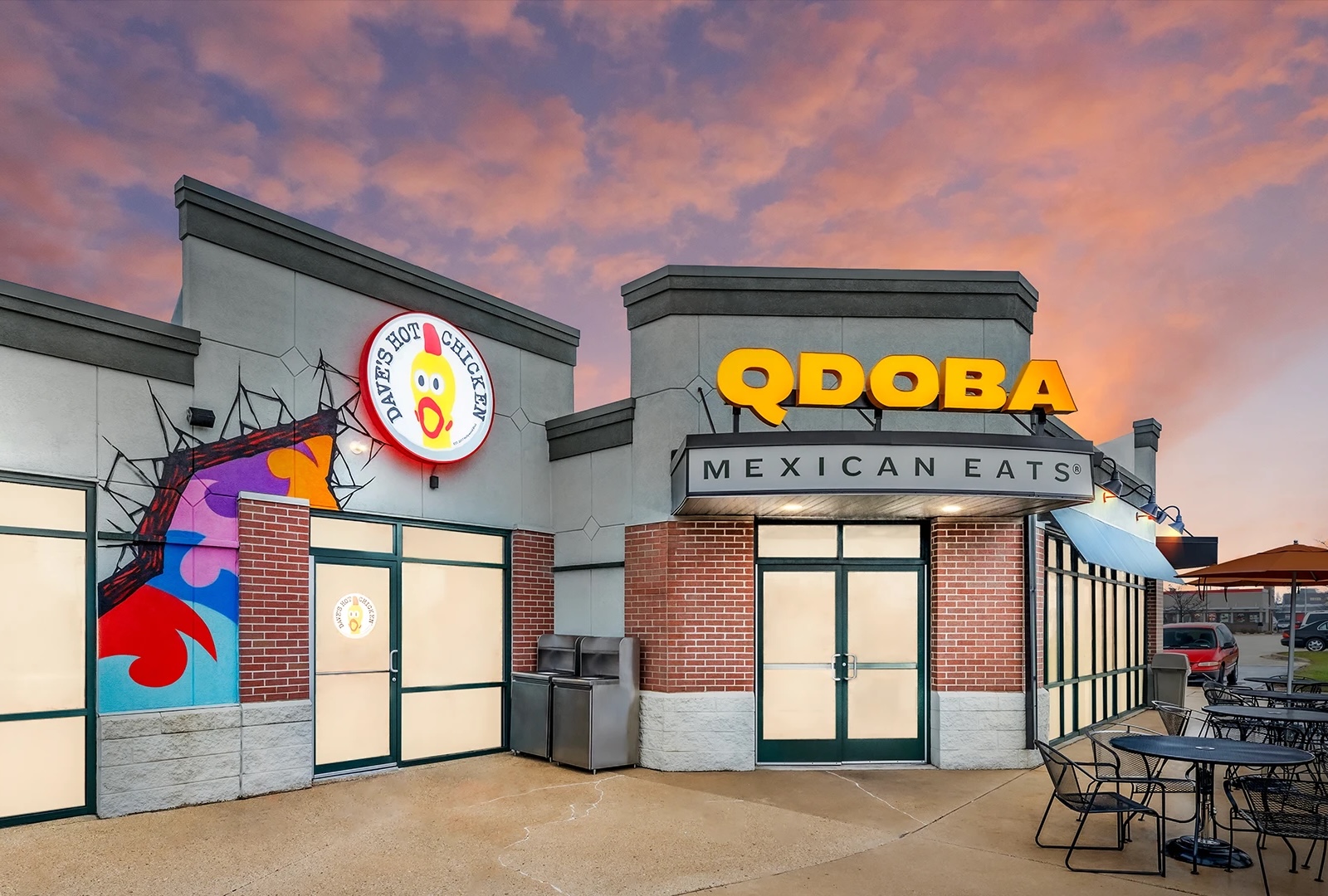 QDOBA Mexican Eats and Dave's Hot Chicken restaurants at sunset.