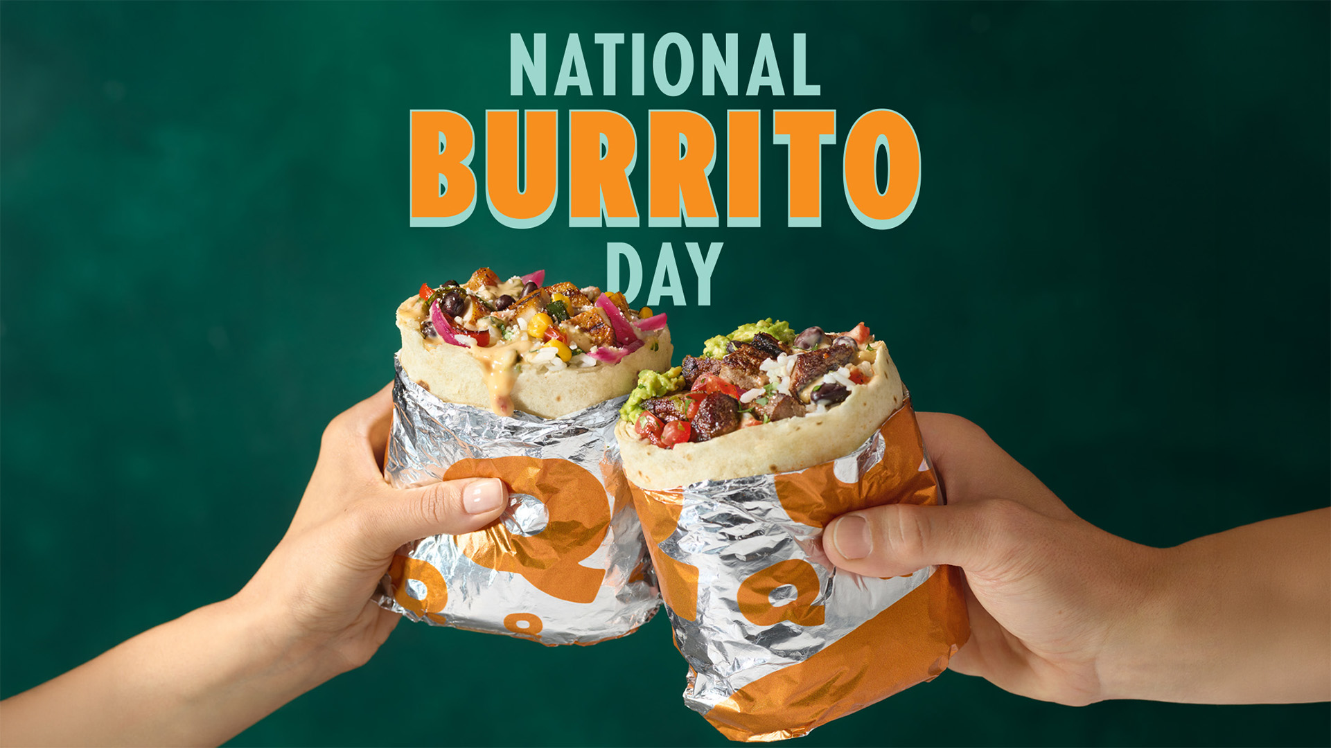 Two hands holding QDOBA burritos filled with steak, queso, guacamole, and fresh toppings under “National Burrito Day” text promoting a BOGO offer.