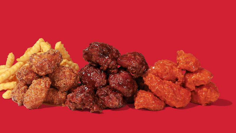 Assorted Dave’s Hot Chicken Saucy Bites coated in Spicy BBQ, Mike’s Hot Honey, and Spicy Buffalo sauce, served with seasoned fries