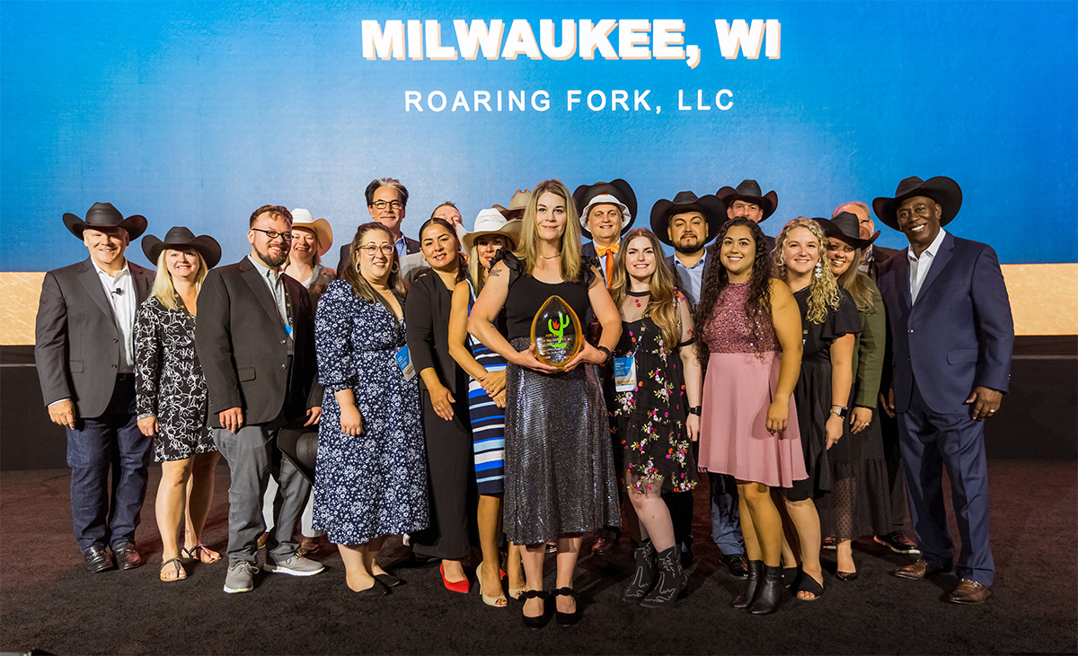 Roaring Fork Restaurant Group team members receiving an award at the 2024 QDOBA Brand Conference in Nashville, Tennessee, showcasing their exceptional achievements and dedication to excellence in the restaurant industry.