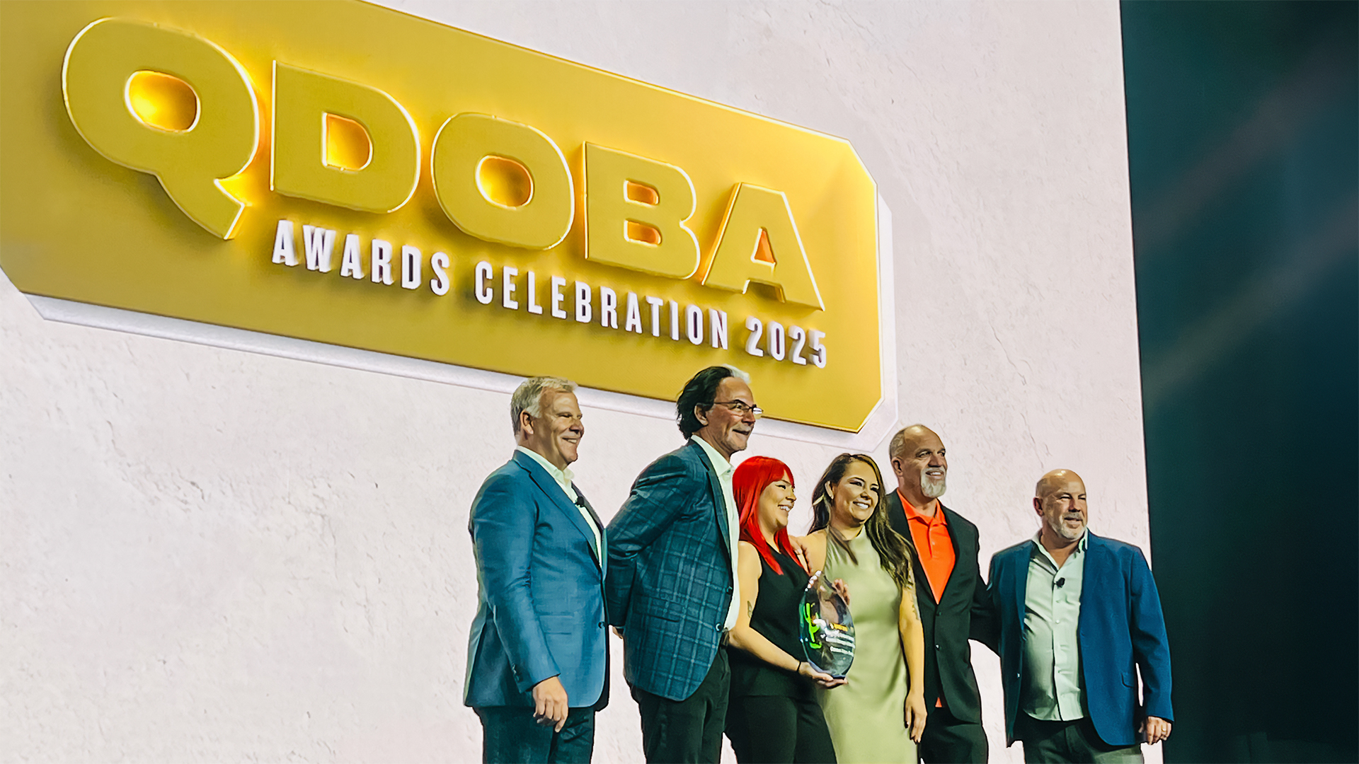 Roaring Fork Restaurant Group team members receiving awards at the 2025 QDOBA Brand Conference, showcasing their exceptional achievements and dedication to excellence in the restaurant industry.
