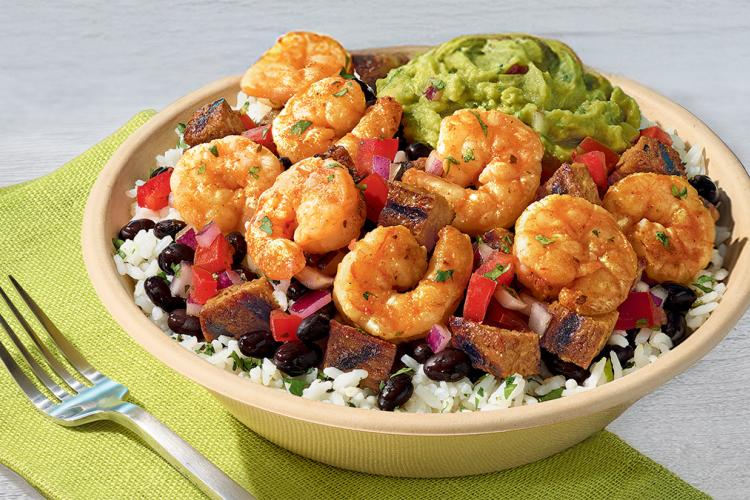 QDOBA Citrus Lime Shrimp bowl with sautéed shrimp, cilantro-lime rice, black beans, pico de gallo, and fresh guacamole