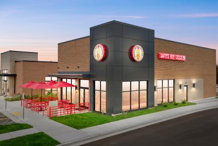 Dave’s Hot Chicken Grafton WI restaurant exterior with patio seating and signage, photographed October 2025.
